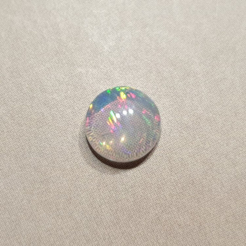Opal from Ethiopia cabochon fi 7 mm no 426 Opal from Ethiopia cabochon fi 7 mm no 426