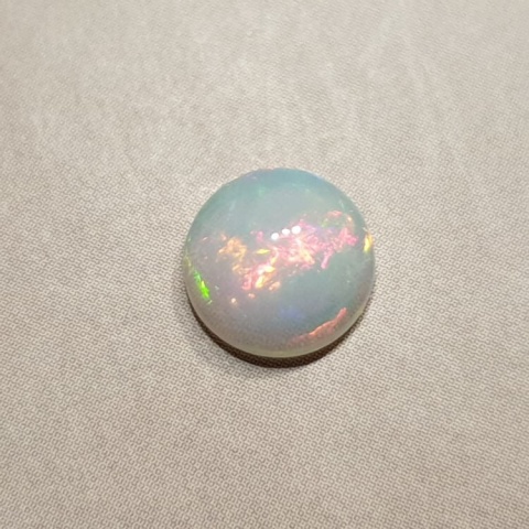 Opal from Ethiopia cabochon fi 8 mm no. 385 Opal from Ethiopia cabochon fi 8 mm no. 385