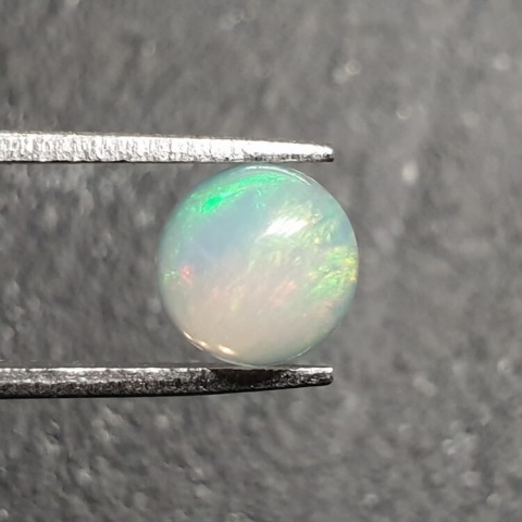 Opal from Ethiopia cabochon fi 8 mm no 386 Opal from Ethiopia cabochon fi 8 mm no 386
