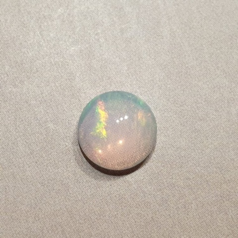 Opal from Ethiopia cabochon fi 8 mm no 386 Opal from Ethiopia cabochon fi 8 mm no 386