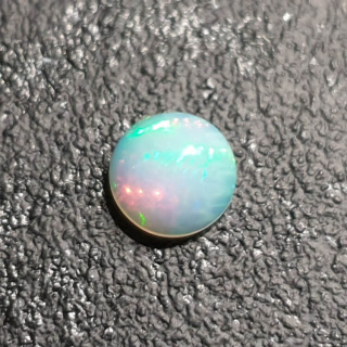 Opal from Ethiopia cabochon fi 8 mm no 387