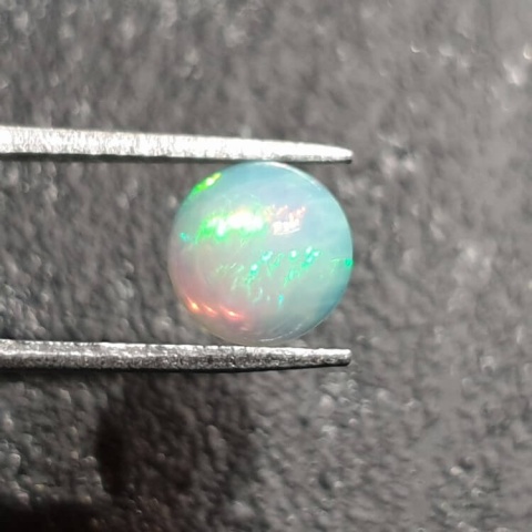 Opal from Ethiopia cabochon fi 8 mm no 387 Opal from Ethiopia cabochon fi 8 mm no 387