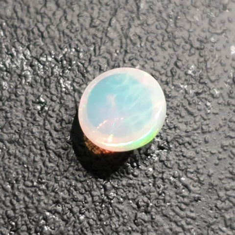 Opal from Ethiopia cabochon fi 8 mm no 387 Opal from Ethiopia cabochon fi 8 mm no 387