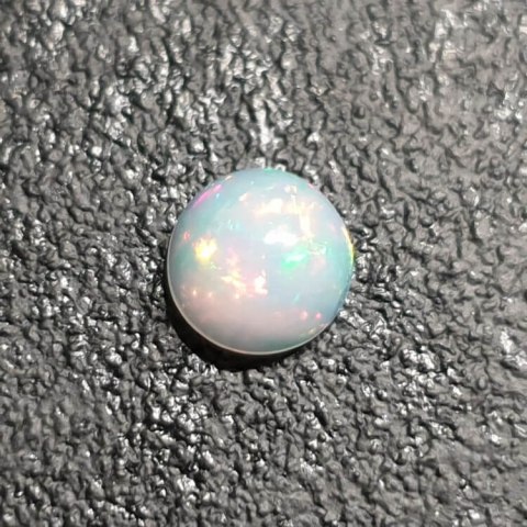 Opal from Ethiopia cabochon fi 8 mm no 393 Opal from Ethiopia cabochon fi 8 mm no 393