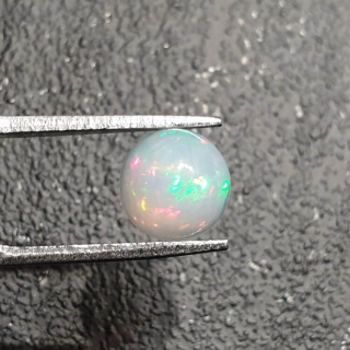 Opal from Ethiopia cabochon fi 8 mm no 393