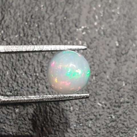 Opal from Ethiopia cabochon fi 8 mm no 393 Opal from Ethiopia cabochon fi 8 mm no 393