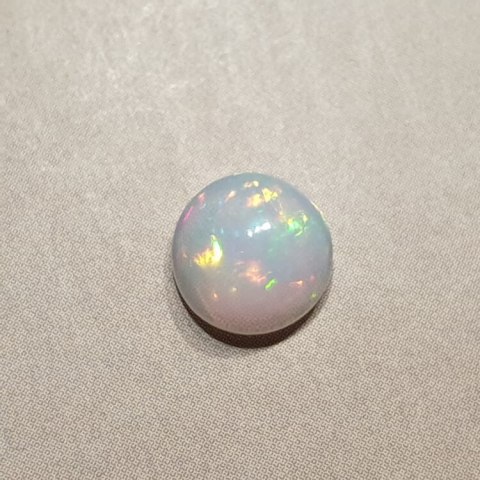 Opal from Ethiopia cabochon fi 8 mm no 393 Opal from Ethiopia cabochon fi 8 mm no 393