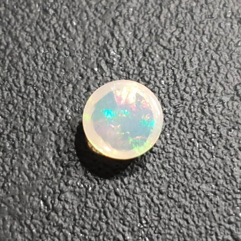 Opal from Ethiopia cabochon fi 8 mm no 395 Opal from Ethiopia cabochon fi 8 mm no 395