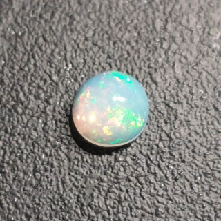 Opal from Ethiopia cabochon fi 8 mm no 401
