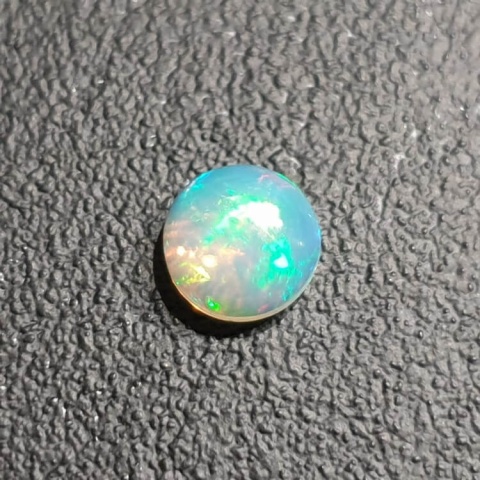 Opal from Ethiopia cabochon fi 8 mm no. 403 Opal from Ethiopia cabochon fi 8 mm no. 403
