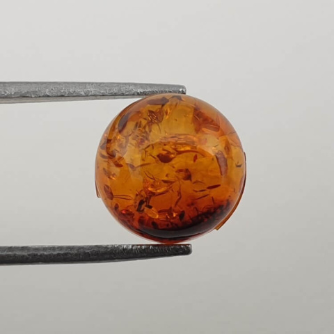 Bursztyn bałtycki kaboszon fi 10 mm nr 645 Bursztyn bałtycki kaboszon fi 10 mm nr 645