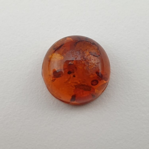Bursztyn bałtycki kaboszon fi 10 mm nr 652 Bursztyn bałtycki kaboszon fi 10 mm nr 652