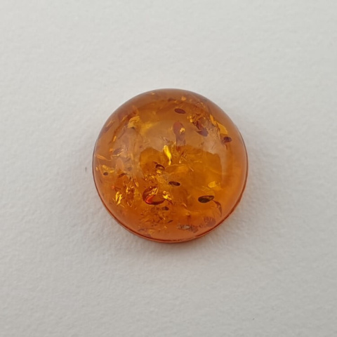 Bursztyn bałtycki kaboszon fi 10 mm nr 675 Bursztyn bałtycki kaboszon fi 10 mm nr 675