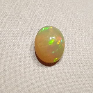 Opal from Ethiopia cabochon 9.02x7.11 mm no 121