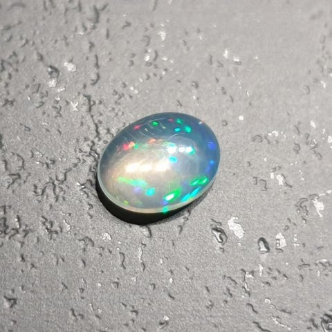 Opal from Ethiopia cabochon 9.07x6.98 mm no. 134 Opal from Ethiopia cabochon 9.07x6.98 mm no. 134