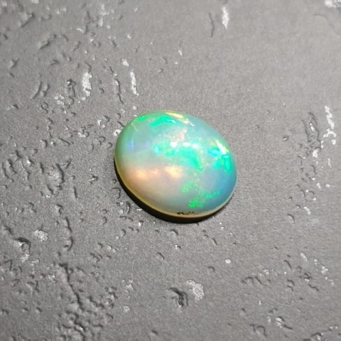 Opal from Ethiopia cabochon 9.07x7.11 mm no. 119 Opal from Ethiopia cabochon 9.07x7.11 mm no. 119