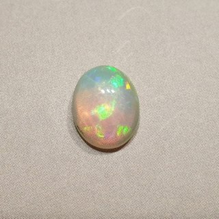 Opal from Ethiopia cabochon 9.07x7.11 mm no 119