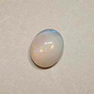 Opal from Ethiopia cabochon 9.17x7.21 mm no 133