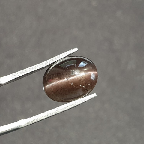 Scapolite cat's eye cabochon 12x9 mm no. 1 Scapolite cat's eye cabochon 12x9 mm no. 1